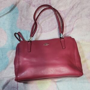 Coach Christie Satchel made of pebbled leather with silver-tone hardware.